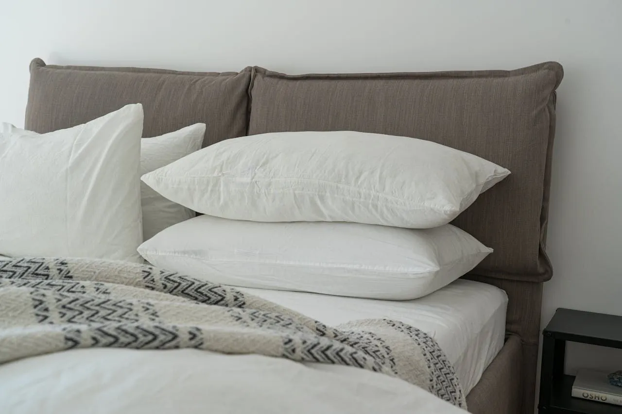 White mattress encasement being zipped closed around a mattress